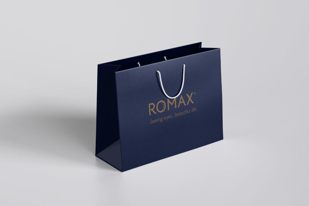 ROMAX branded navy shopping bag with gold logo